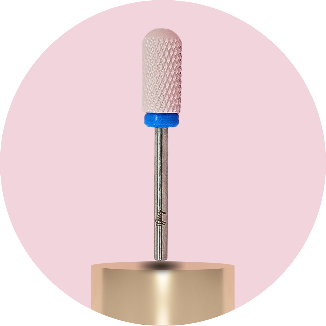 Nail drill bit with textured ceramic head on a pink background