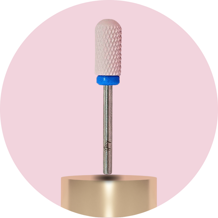 Nail drill bit with textured ceramic head on a pink background