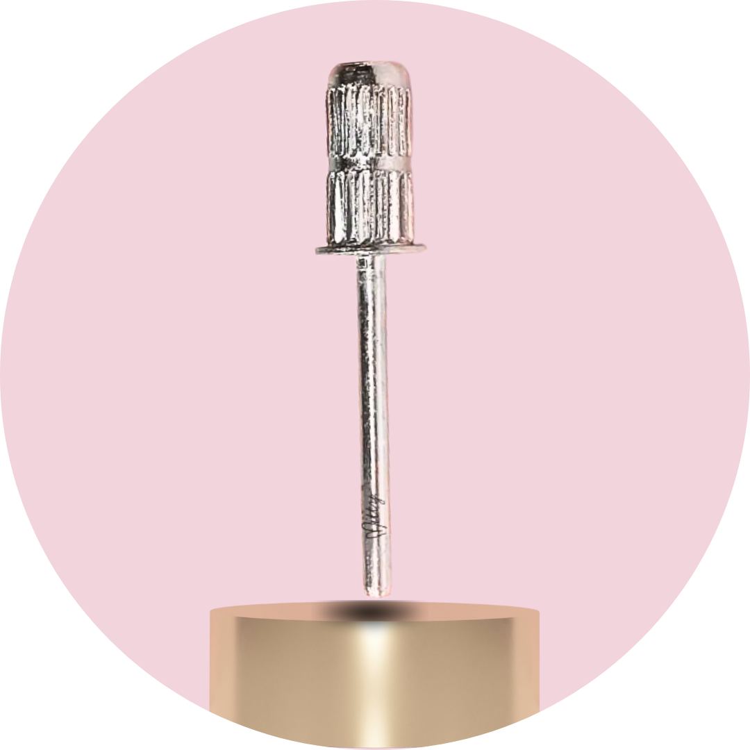 Metal drill bit on a pink background