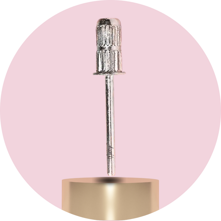 Metal drill bit on a pink background