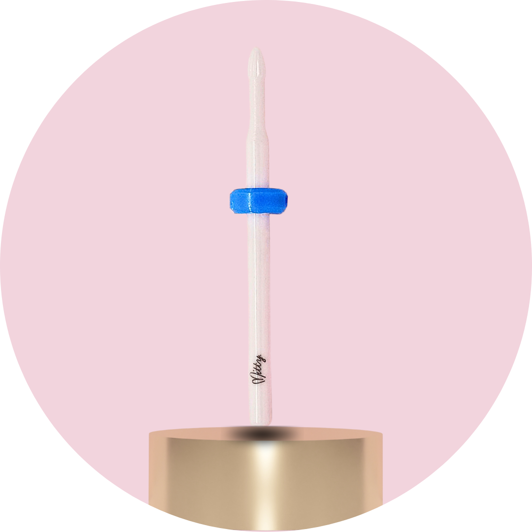 Candle with a blue wick on a pink background